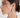 Silver Ribbed Teardrop Statement Earrings worn on model in side-profile close-up, featuring a sculptural polished silver finish and textured ridged design.
