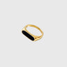 Gold minimalist oval signet ring on silver surface – Sinai Ring by Matte.