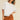 Toto Crop Top front view on model wearing oversized white crewneck tee.