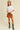 Toto Crop Top full body view styled with brown mini skirt.