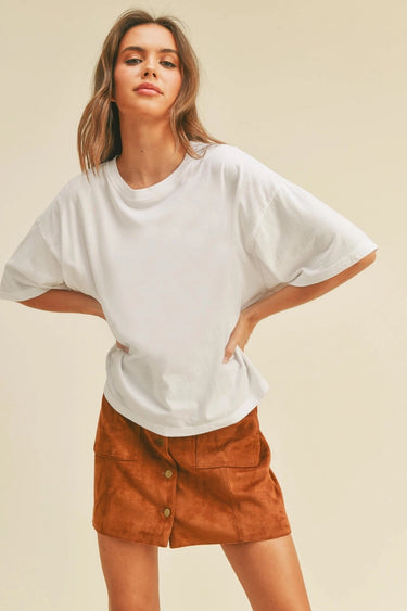 Toto Crop Top angled view on model highlighting dropped shoulders and loose silhouette.