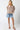 Tyrath Blouse leopard puff sleeve blouse styled casually with denim, photographed in studio lighting to show movement, sleeve volume, and neutral animal print pattern.