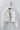 White cropped utility jacket with drawstring hem and front pockets.