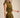 Uvek Top olive and gold striped sleeveless top worn with matching skirt, showing fitted waist and flowing silhouette.