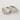 Velluto Huggie Earrings, silver huggie hoop earrings with baguette-cut crystal design and polished mirror finish, photographed on white linen background with soft editorial lighting.