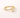 Voluspa Ring gold band with clear pear-shaped gemstone on neutral background