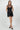 Wada Top worn by model, full body view, styled for a night-out look with a fitted mini silhouette.