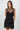 Wada Top worn by model, front view, featuring black mesh overlay, fitted corset-style shape, and ruched detailing.
