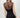 Wada Top worn by model, back view, showing sheer mesh upper and fitted silhouette.