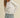 Model wearing white Essential Long Sleeve Tee by Matte with denim shorts, front view