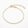 Whizat Bracelet delicate gold chain bracelet with fine structured links on a light gray background with soft shadow.
