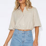 Wims Cropped Shirt worn by model, front view, featuring relaxed short sleeves, button-front design, and elasticated hem.