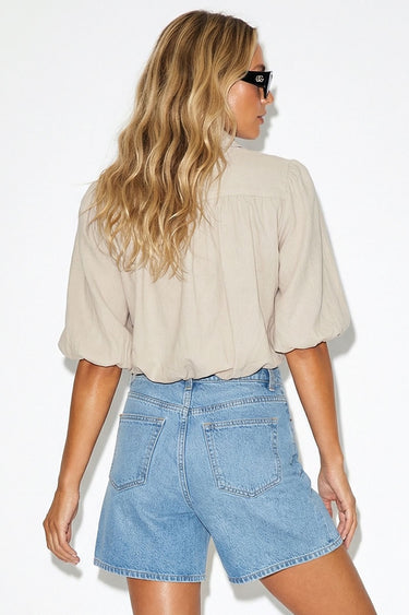 Wims Shirt worn by model, full body back view, styled with denim shorts, showing cropped fit and lightweight fabric.