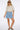 Wims Cropped Shirt worn by model, full body view, highlighting relaxed silhouette and warm-weather styling.
