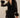 Yanz Mesh Top sheer feather-trim top styled with black pants full outfit posed.