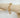 Adeline gold chunky link bracelet on wood display