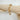 Adeline gold chunky link bracelet on wood display