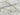 Albacete Necklace by Matte, gold plated chain necklace displayed on marble tile background