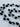 Alkemie Freshwater Pearl Necklace by Matte, Tahitian black freshwater pearls with silver beading on neutral fabric background