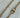 Allison necklace by Matte, gold plated chain necklace with 18″ length displayed on stone background