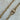 Allison necklace by Matte, gold plated chain necklace with 18″ length displayed on stone background