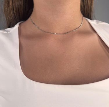 Model wearing Aluna Necklace by Matte, silver flat chain, minimalist choker, 14 inch