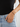 Model wearing the Amurk Bracelet styled on the wrist with casual denim and a black top, highlighting the bracelet's adjustable fit, black bead detailing, and modern layered everyday look.