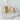 Ankara stud earrings by Matte, gold plated oval dome studs on neutral background