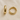 Gold elongated polished huggie earrings on white linen backdrop, Apress Huggie Earrings.