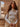 Askett Bodysuit long sleeve fitted bodysuit with high neckline in soft ivory fabric worn by model.