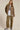 Front view of the Aspen Utility Jacket highlighting the oversized silhouette, structured utility design, long sleeves, and versatile mocha fabric.