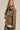 Three-quarter front view of the Aspen Utility Jacket highlighting the oversized silhouette, structured utility design, long sleeves, and versatile mocha fabric.