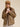 Close-up lifestyle image of the Aspen Utility Jacket highlighting the structured collar, snap-button front, utility pockets, and relaxed oversized fit.