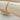 Atela Bracelet gold plated square link chain displayed on wood bar