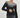 Woman wearing a black ribbed knit sweater with white contrast neckline, long sleeves, and slim fit — Aurora Sweater by Matte.

