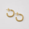 Be Hoop Earrings featuring polished gold-plated hoop earrings with a fine ribbed rope texture, rounded classic hoop silhouette, high-shine finish, lightweight design, secure post-back closure, and an elegant everyday style.