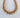 A gold-plated bold chunky chain necklace on a white background.