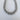 A gold-plated chunky chain necklace on a white background.
