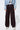 Front view of Lisboa Pants styled with denim jacket and sneakers.
