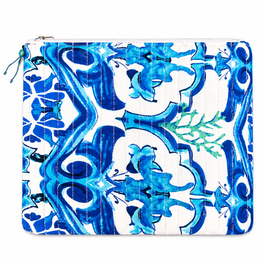 Beach pouch with blue Mediterranean tile-inspired print featuring intricate ornamental pattern on a compact zip pouch.