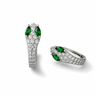 Silver pavé snake hoop earrings with emerald green marquise stones on white marble surface