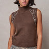 Woman wearing the Boon sleeveless mock-neck knit top in brown with crystal shoulder embellishments and a relaxed fit.