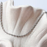 Bruma Necklace by Matte, silver twisted rope chain on ceramic surface