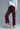 Burgundy Wide-Leg Pants in deep wine shade, angled 3/4 view highlighting wide-leg silhouette.