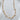Calypsa Necklace by Matte, gold plated chain with 4mm pearls on white background