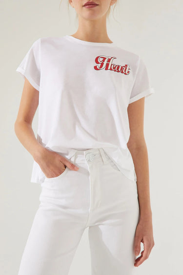 Model wearing Camelia Jeans in white high-rise wide-leg fit.