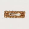 Canelle Hair Clip rectangular shape with gold crystals on white background, elegant accessory photo for Matte.