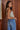 Carmel Top side view showing fitted ribbed silhouette and sleeveless design.