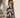 Celani Maxi Dress strapless brown floral maxi dress with oversized cream floral print worn on model showing full length flowy silhouette.