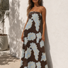 Celani Maxi Dress strapless brown floral maxi dress with oversized cream floral print worn on model showing full length flowy silhouette.
